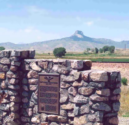 Heart Mountain Wyoming Foundation interpretive center, with the original guard tower foundation in the foreground and Heart Mountain itself rising in the background.