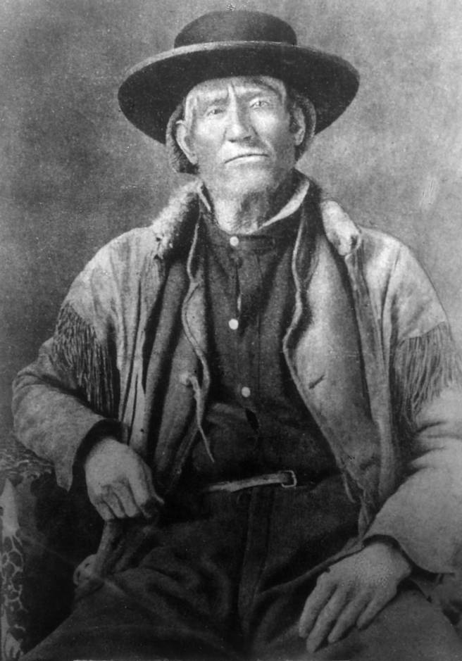 Period portrait of Jim Bridger, mountain man and trader, in buckskins with a long rifle.