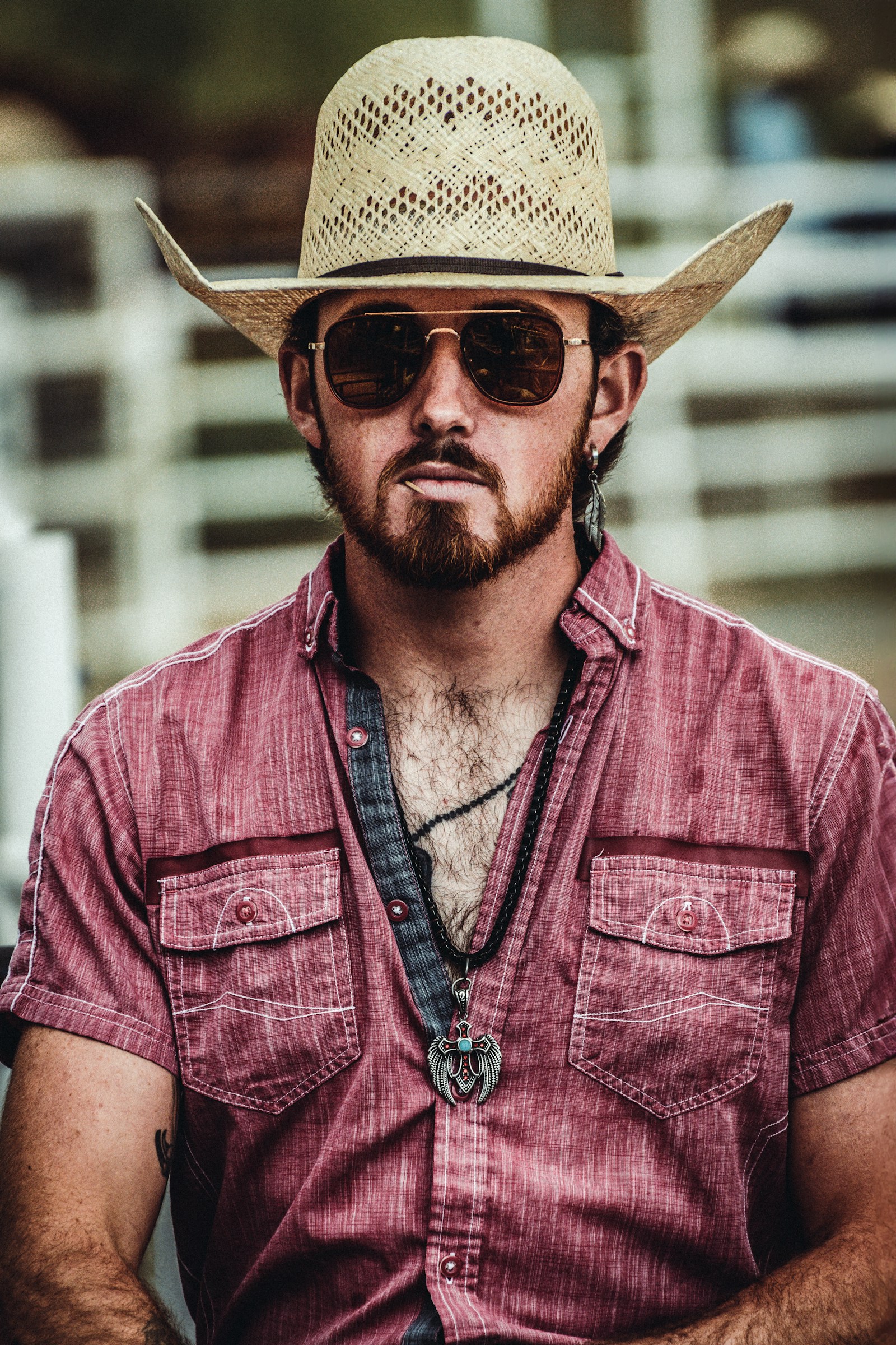 Western cowboy in classic open-road style hat and sunglasses.