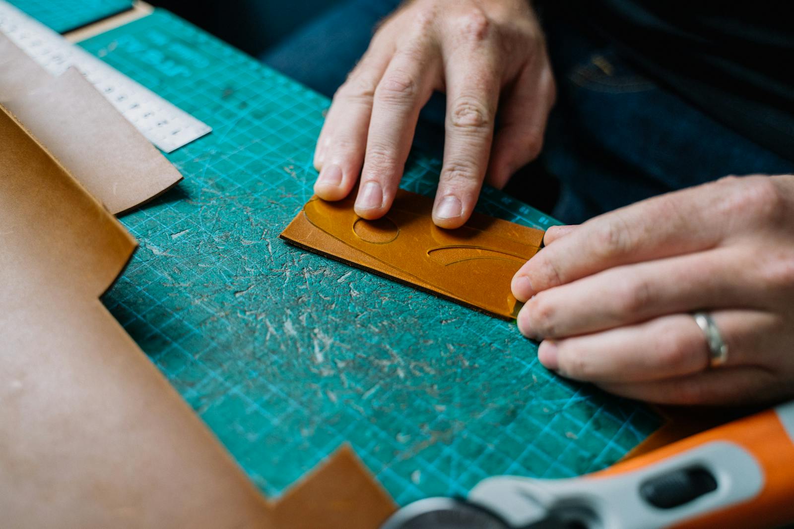 Detail of leather being conditioned with cloth and product.