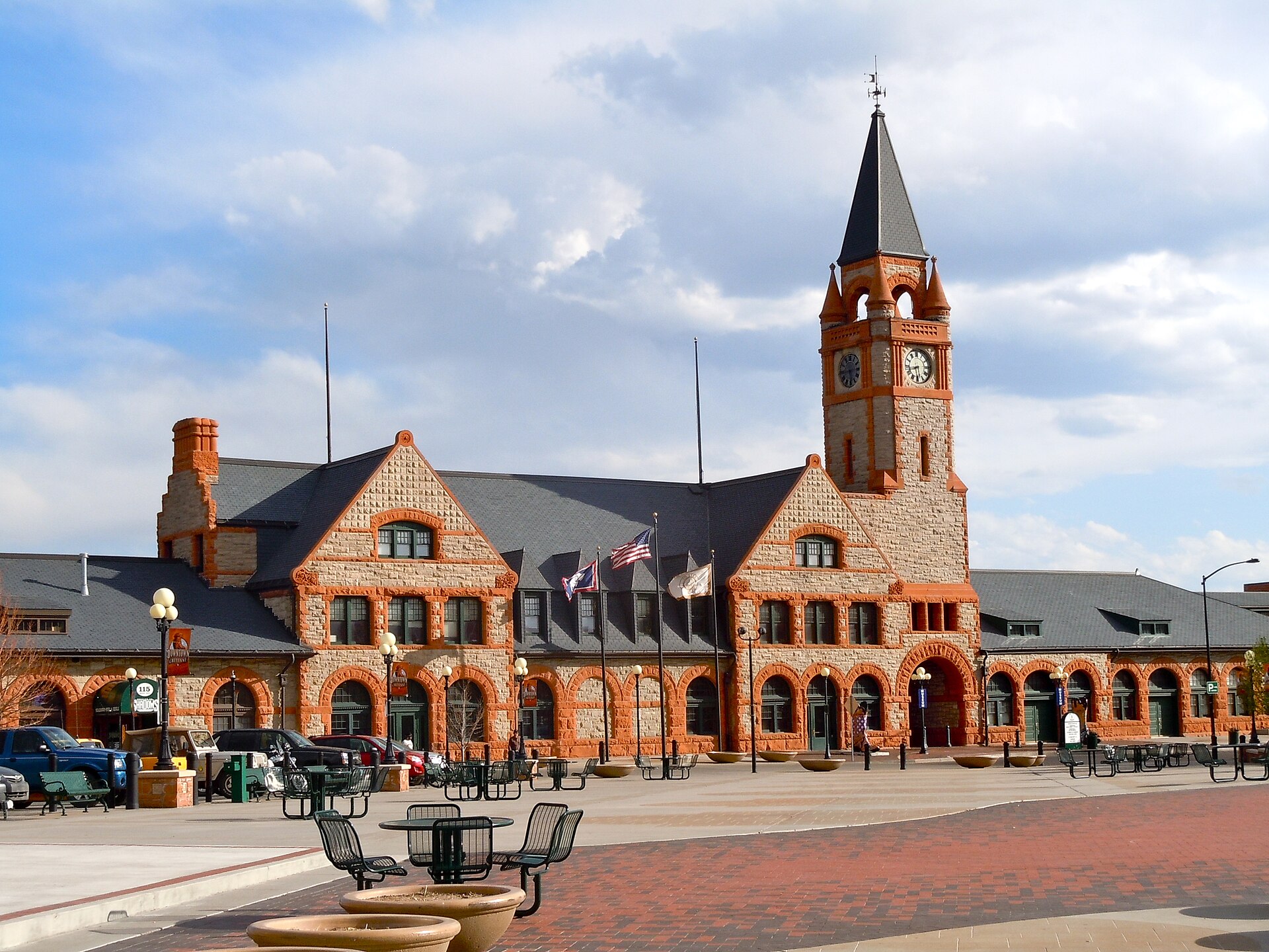 The historic Cheyenne Union Pacific Depot building, a Romanesque Revival structure with a prominent clock tower on the main street of downtown Cheyenne, Wyoming.