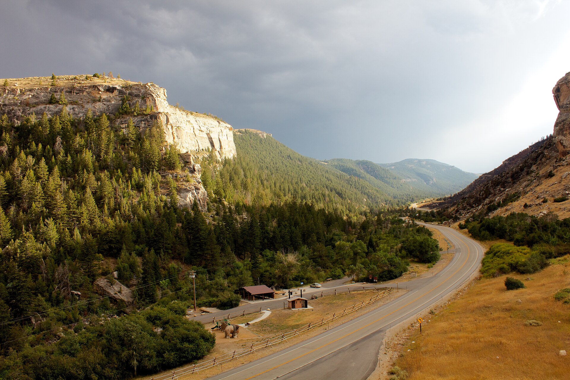 Sinks Canyon State Park near Lander, Wyoming, with the Popo Agie River disappearing into a limestone cave at The Sinks under towering canyon walls.